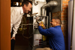Blog 4 Two men repairing furnace in Fresno, CA